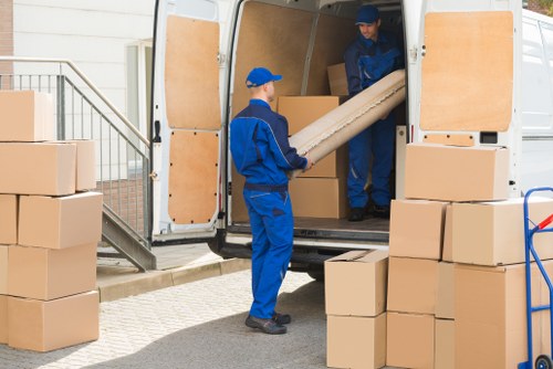 Professional packing services preparing boxes in a Coombe home