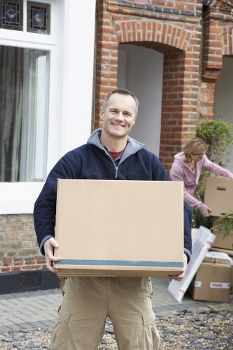 Man With Van Coombe team loading items safely with protective measures in place