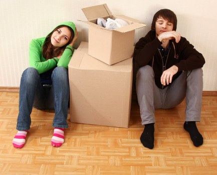 Packed moving boxes and labelled items ready for removals