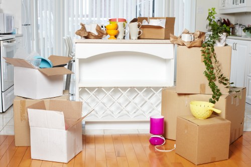 Packed boxes and moving equipment ready for a house move in Coombe