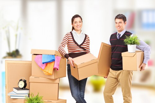 Packed household items being loaded into a van