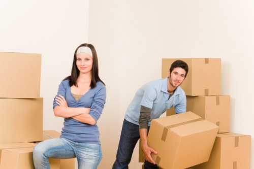 Furniture and boxes being moved by a man and van team
