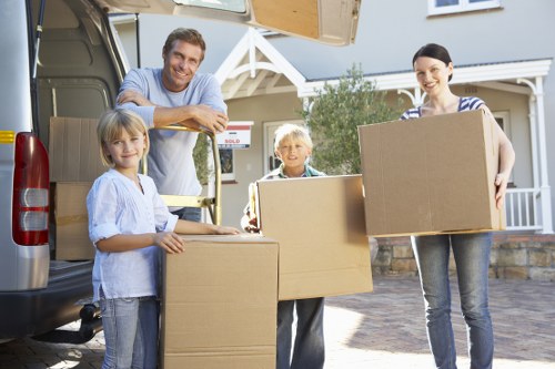 Professional movers loading a van for a Coombe move