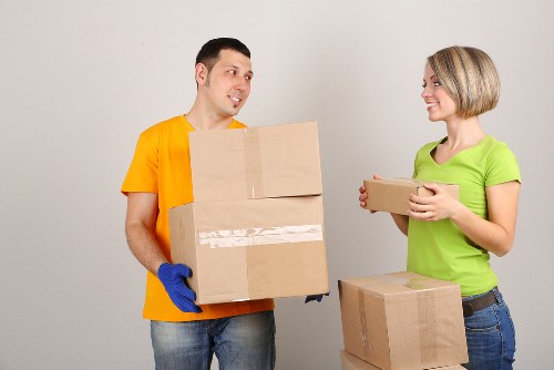 Moving crew using safe lifting practices during a man and van service