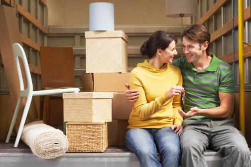 Careful loading of household items into a removal van